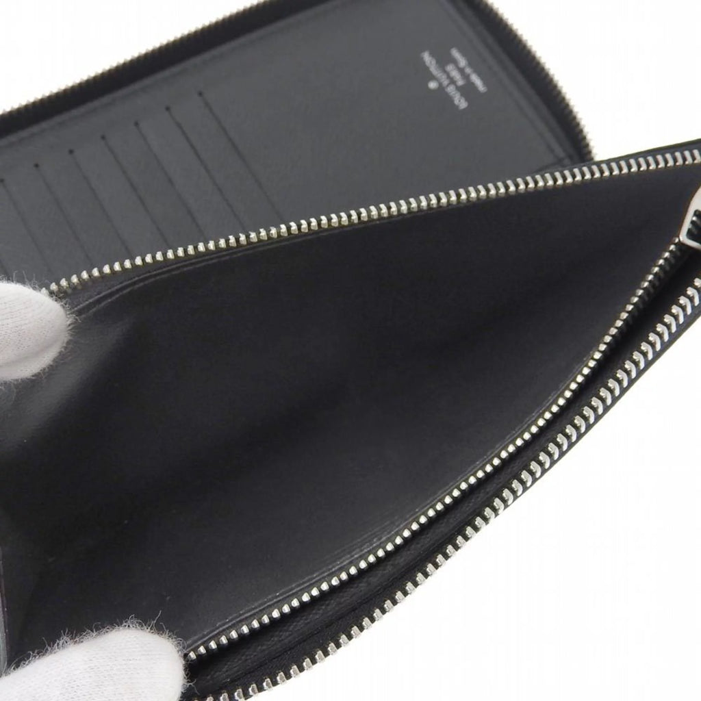 Secondhand Louis Vuitton LOUIS VUITTON Taiga Zippy Wallet Vertical Round Zipper Long Noir M30503 (Good)